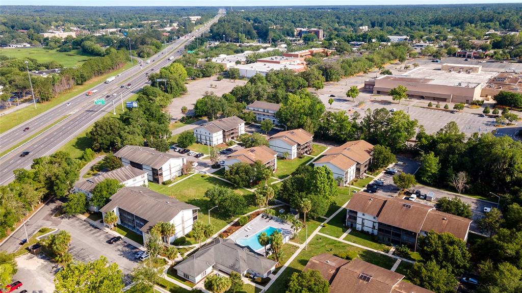 6519 West Newberry Road, Unit 1210 Gainesville, FL 32605 - Photo 2 of 16 an aerial view of residential houses with outdoor space