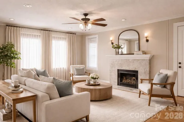 a living room with furniture and a fireplace
