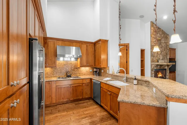 a kitchen with sink cabinets and appliances