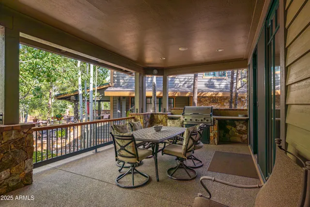 a dining room with furniture water view and balcony