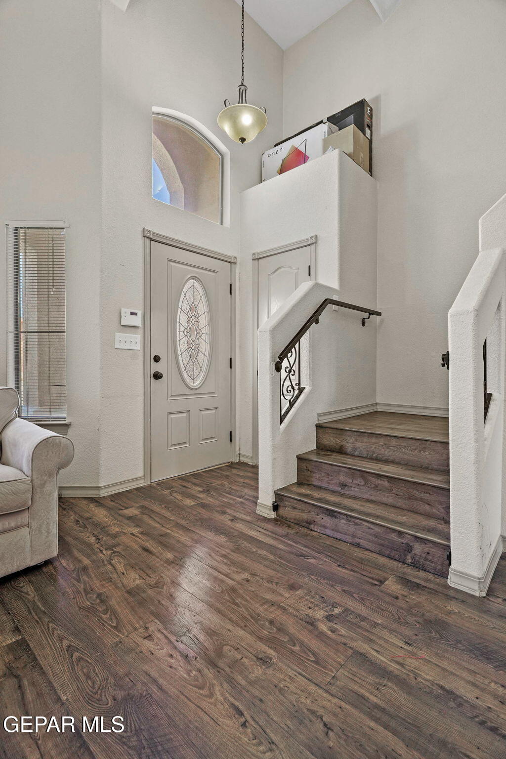 3152 Rustic Hidden Drive El Paso, TX 79938 - Photo 6 of 38 a view of a hallway with entryway wooden floor and front door