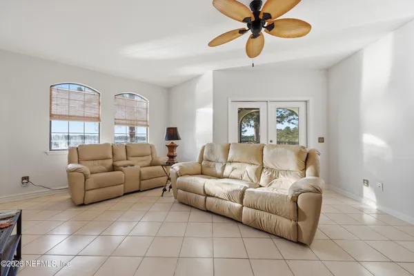 a living room with furniture and a window