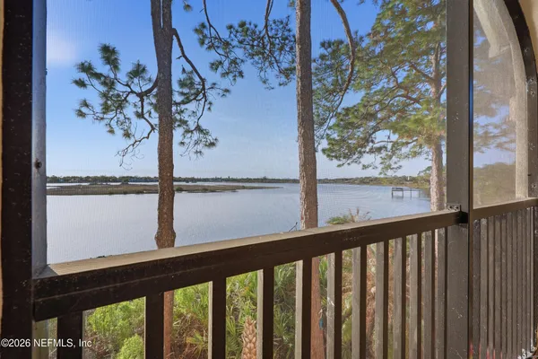 a view of a balcony with a tree