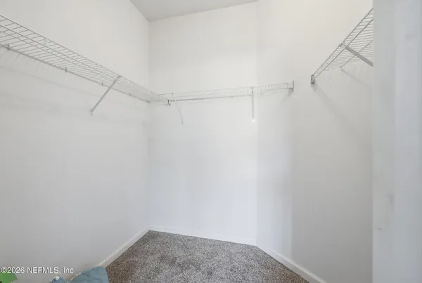 a view of a room with racks on the wall