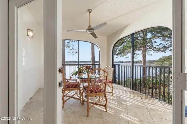 a view of a dining room with furniture window and outside view