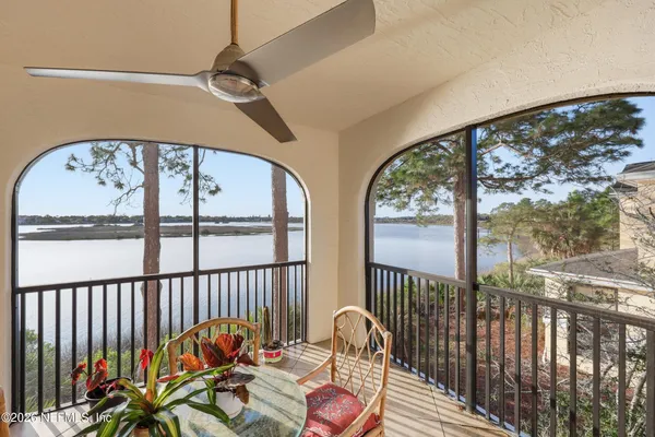 a view of a balcony with furniture