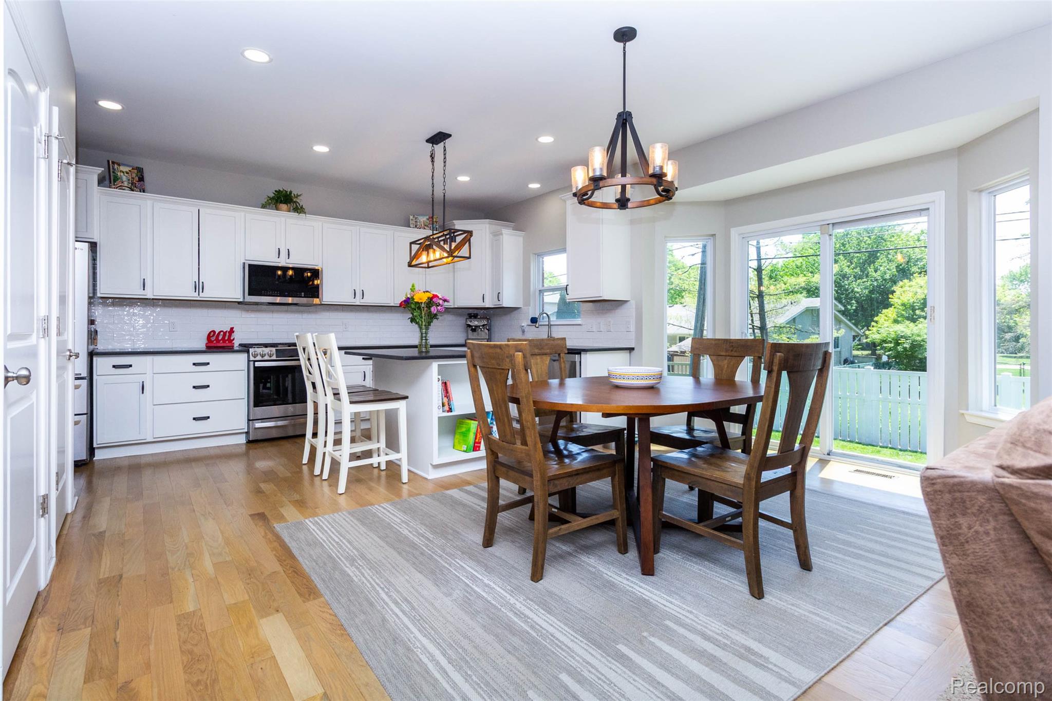 36039 Curtis Road Livonia, MI 48152 - Photo 11 of 61 Open-concept kitchen and dining area featuring light wood-finish flooring