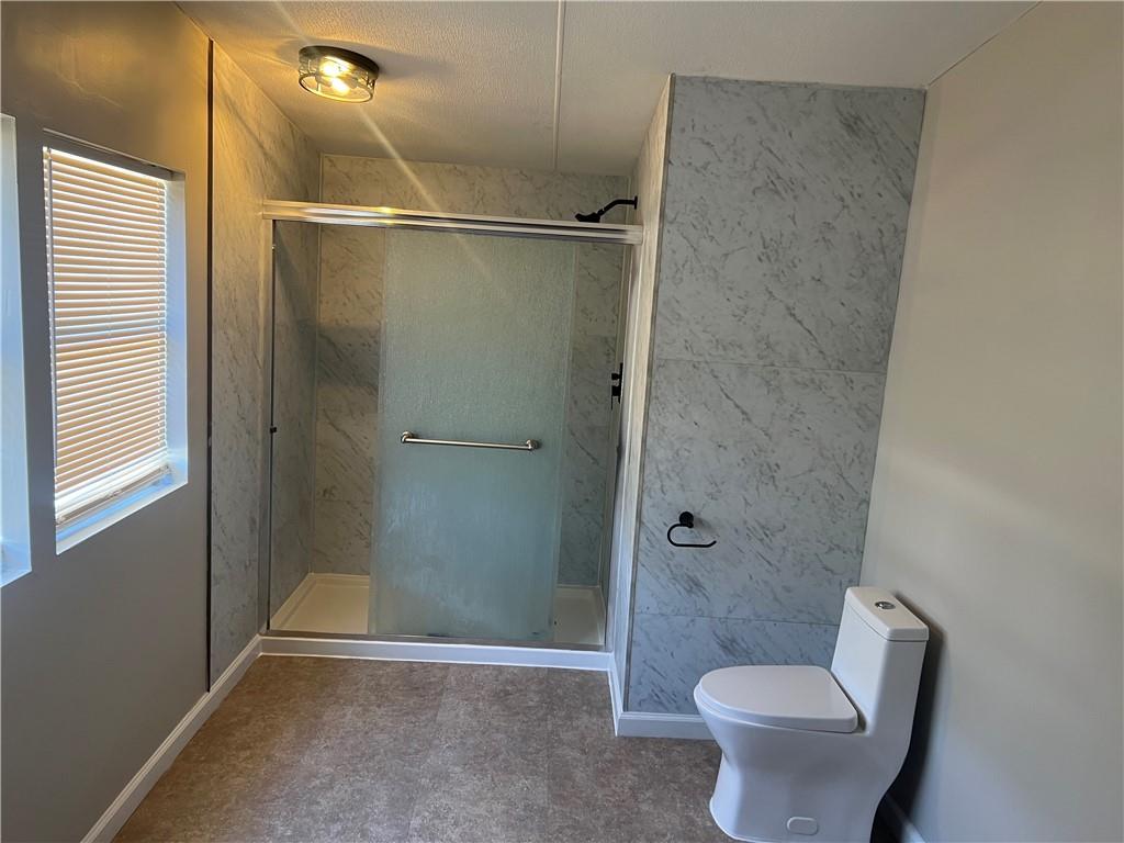 511 Chapel Hill Road Manchester, GA 31816 - Photo 4 of 7 a bathroom with a shower and a toilet