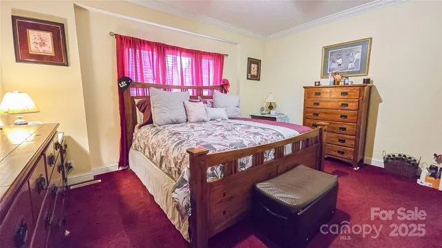 a bed room with a bed and a window