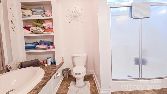 a living room with furniture and a painting on the wall