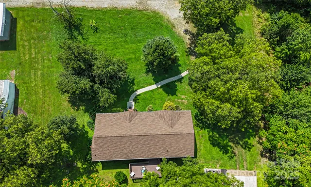 an outdoor space with lots of trees