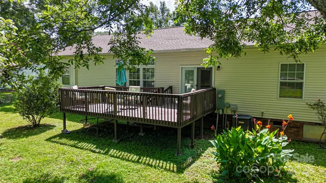 a view of a chair and table in the garden
