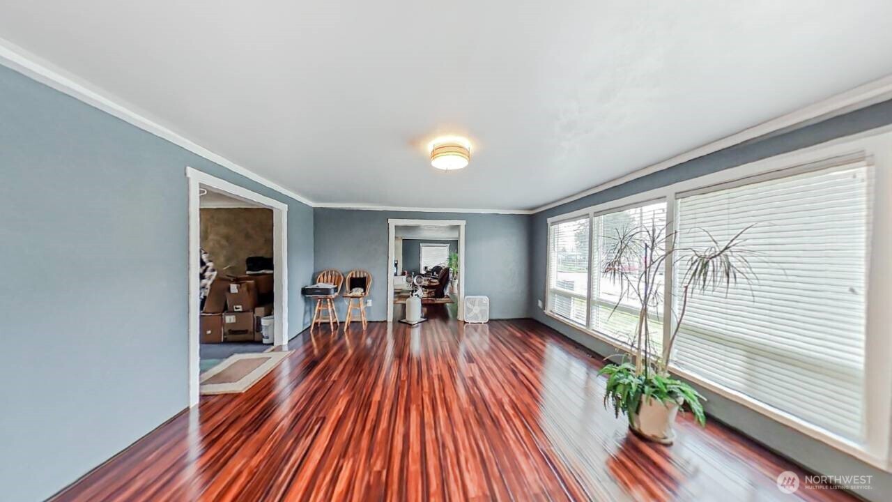 283 Division Avenue Morton, WA 98356 - Photo 4 of 12 wooden floor in an empty room with a window