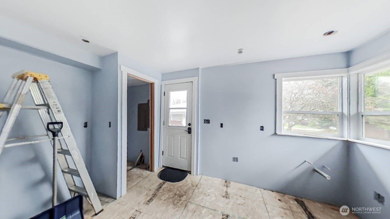 283 Division Avenue Morton, WA 98356 - Photo 6 of 12 a bedroom with a bed and a window