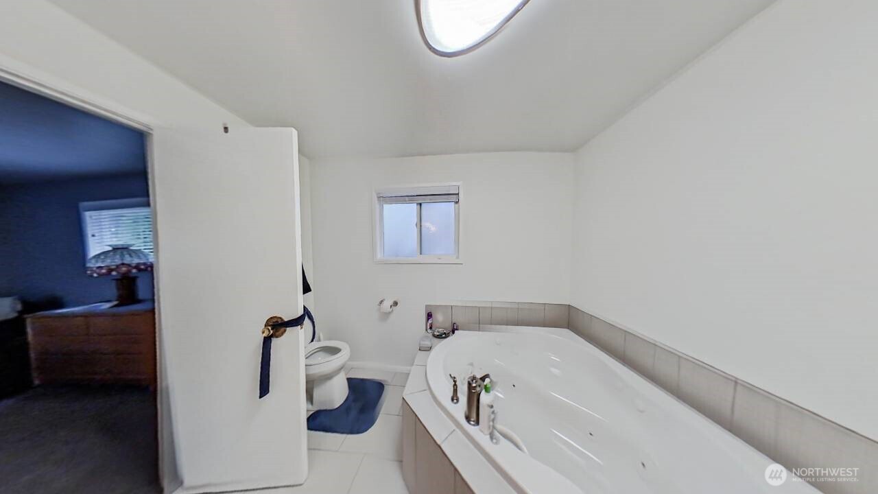 283 Division Avenue Morton, WA 98356 - Photo 10 of 12 a bathroom with a tub and a toilet