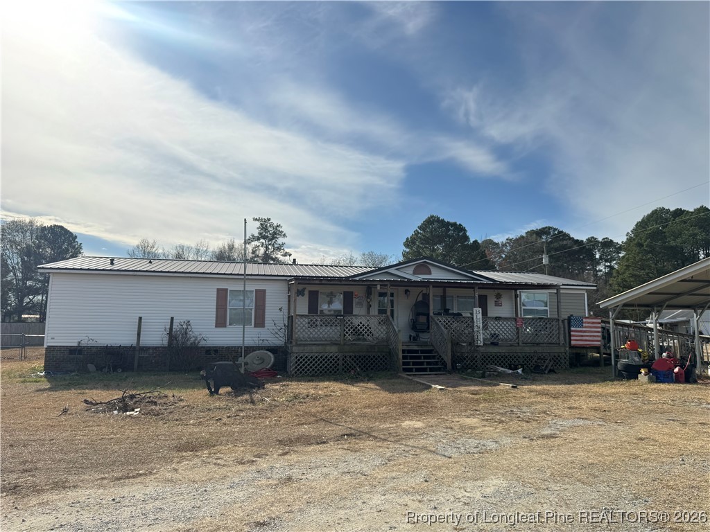 5306 Temperance Hall Road Elm City, NC 27822 - Photo 1 of 22 a view of a house with wooden fence