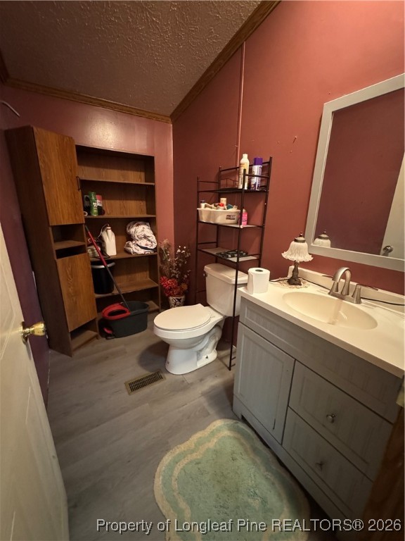 5306 Temperance Hall Road Elm City, NC 27822 - Photo 15 of 22 a bathroom with a sink mirror vanity and toilet