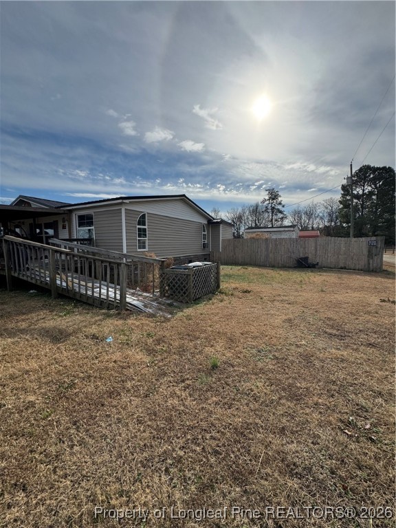 5306 Temperance Hall Road Elm City, NC 27822 - Photo 20 of 22 a view of a house with a yard
