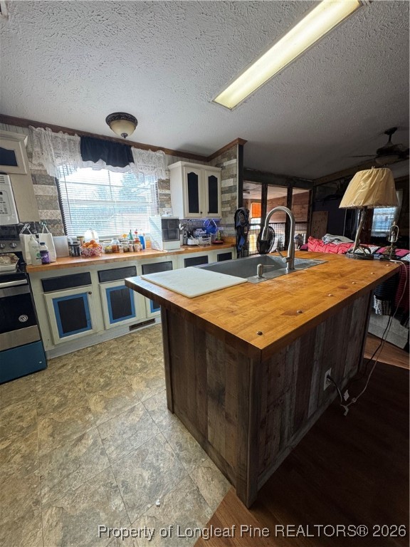 5306 Temperance Hall Road Elm City, NC 27822 - Photo 6 of 22 a kitchen with stainless steel appliances granite countertop a stove and a sink