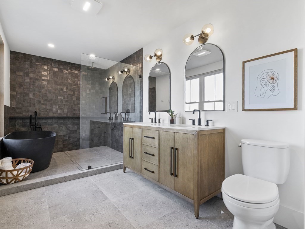 30 Westvale Road Medford, MA 02155 - Photo 19 of 35 a spacious bathroom with a toilet sink and mirror