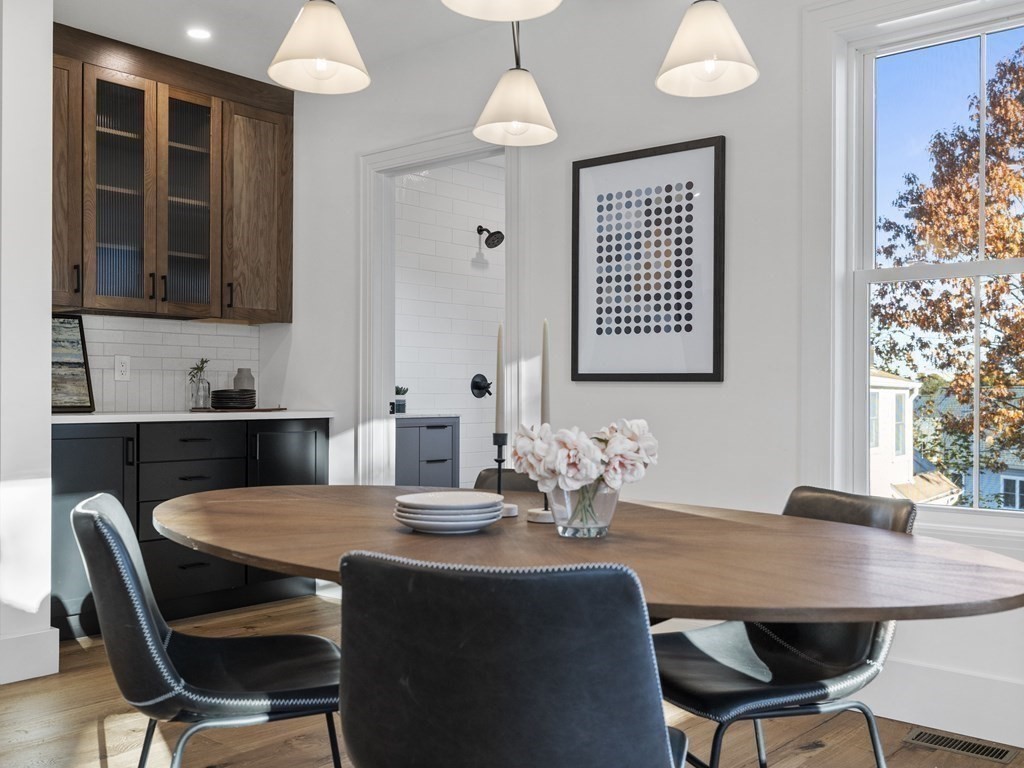 30 Westvale Road Medford, MA 02155 - Photo 5 of 35 a view of a dining room with a table and chairs