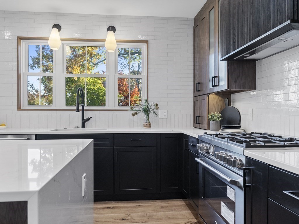 30 Westvale Road Medford, MA 02155 - Photo 8 of 35 a kitchen with stainless steel appliances a sink stove and window