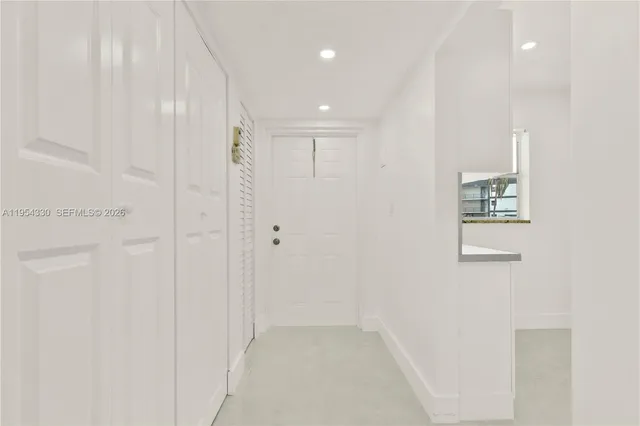 a view of a hallway with closet