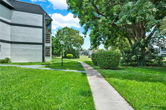 a view of multiple houses with a yard