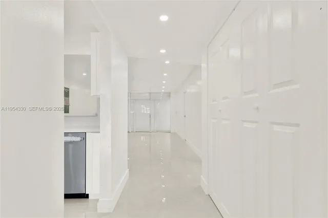 a bathroom with a shower and a glass door