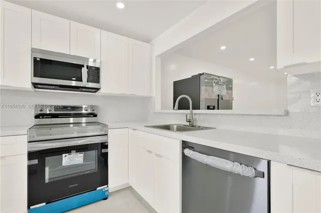 a kitchen with a stove and a microwave