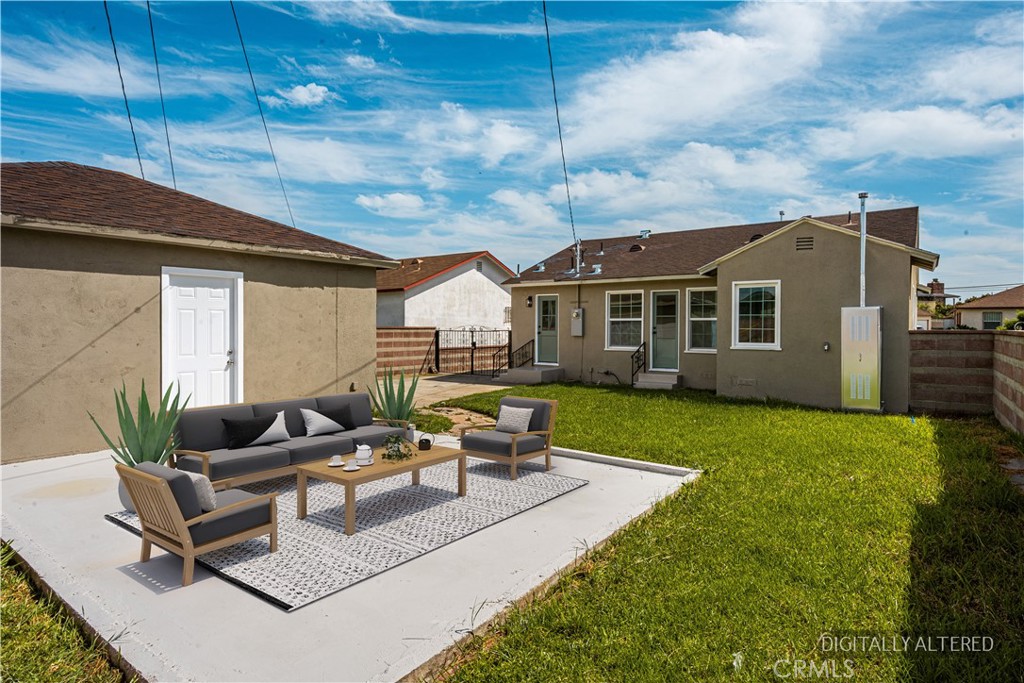 1013 West 138th Street Compton, CA 90222 - Photo 26 of 30 a backyard of a house with table and chairs