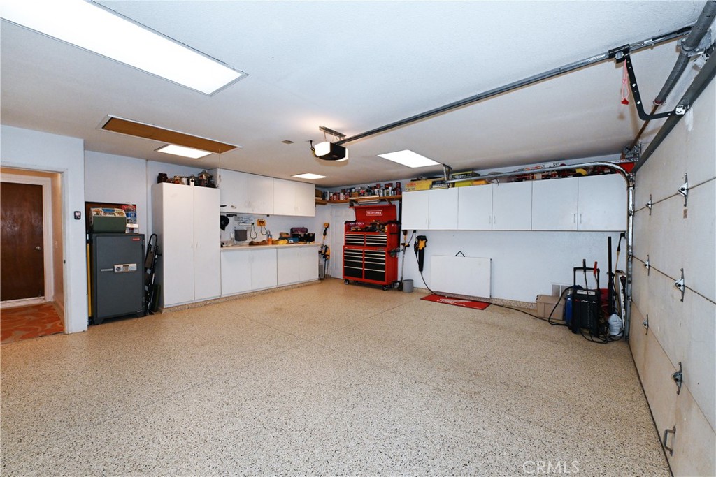 17371 Mockingbird Canyon Road Riverside, CA 92504 - Photo 29 of 73 Garage with Epoxy floors and builtins