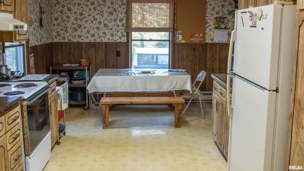 a bed sitting in a room next to a window