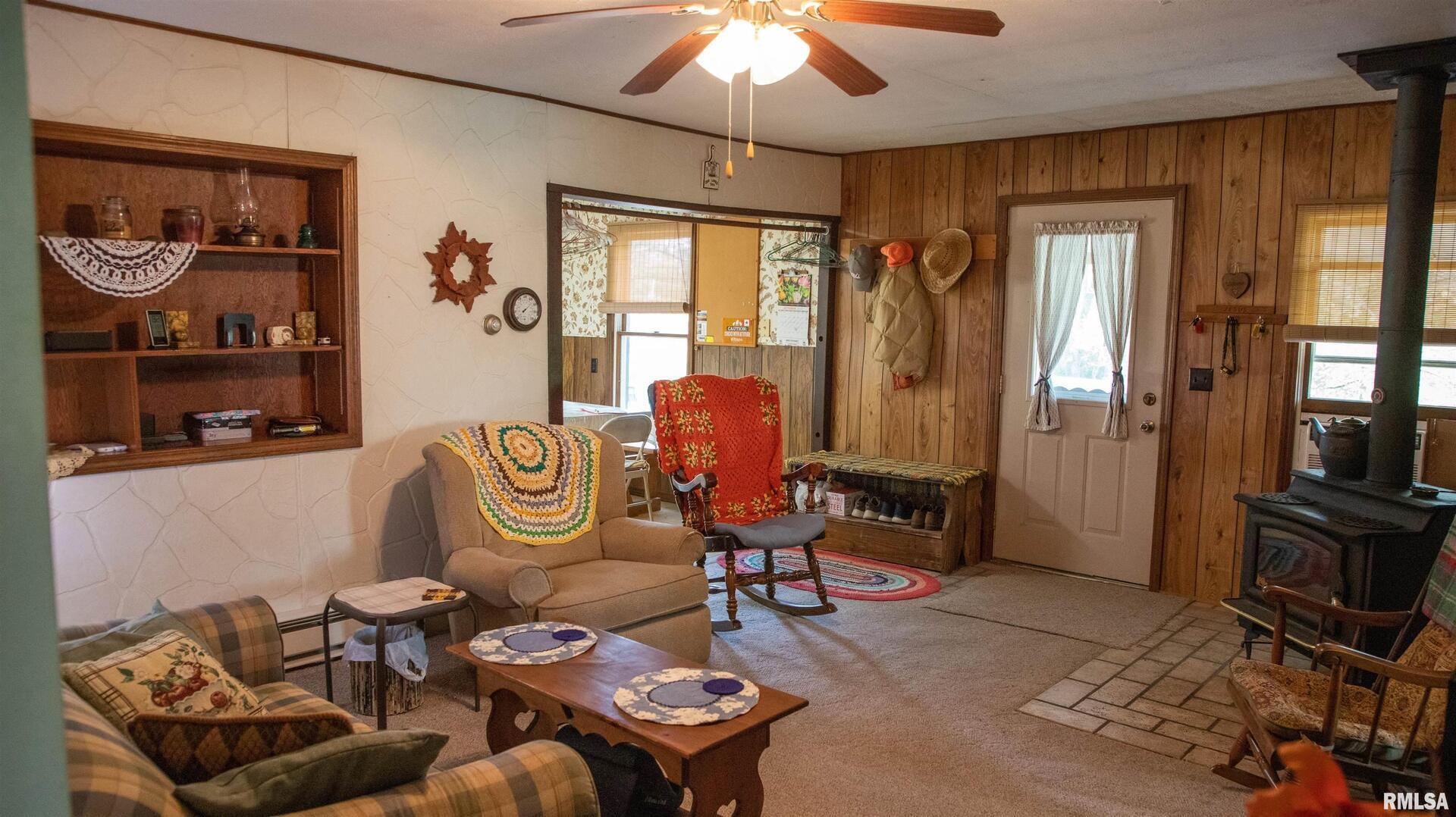 2680 Highway 45 Vienna, IL 62995 - Photo 9 of 20 a living room with furniture a rug and a window