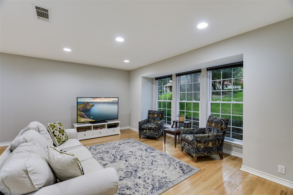 7615 Rockpoint Drive Austin, TX 78731 - Photo 12 of 30 a living room with furniture and a flat screen tv