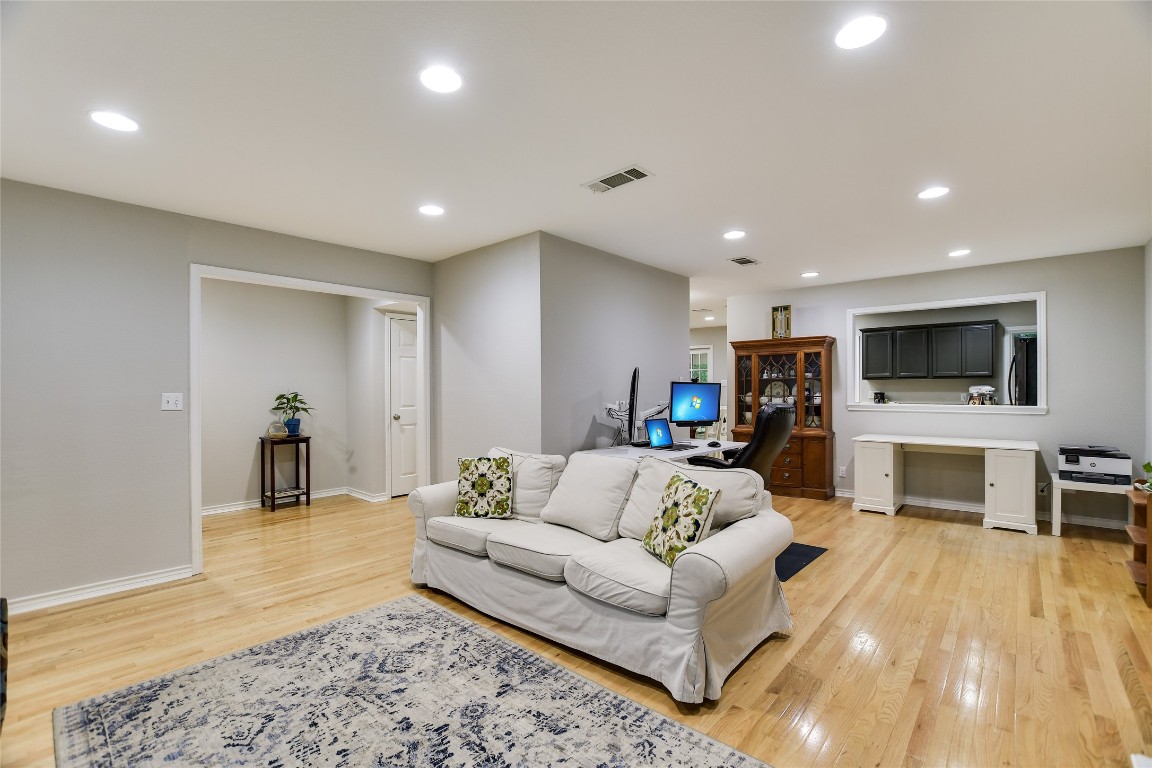 7615 Rockpoint Drive Austin, TX 78731 - Photo 14 of 30 a living room with furniture and a flat screen tv