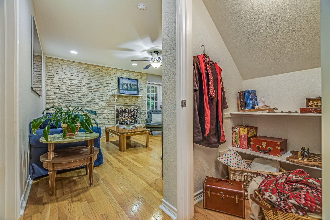 7615 Rockpoint Drive Austin, TX 78731 - Photo 16 of 30 a living room with furniture and a book shelf
