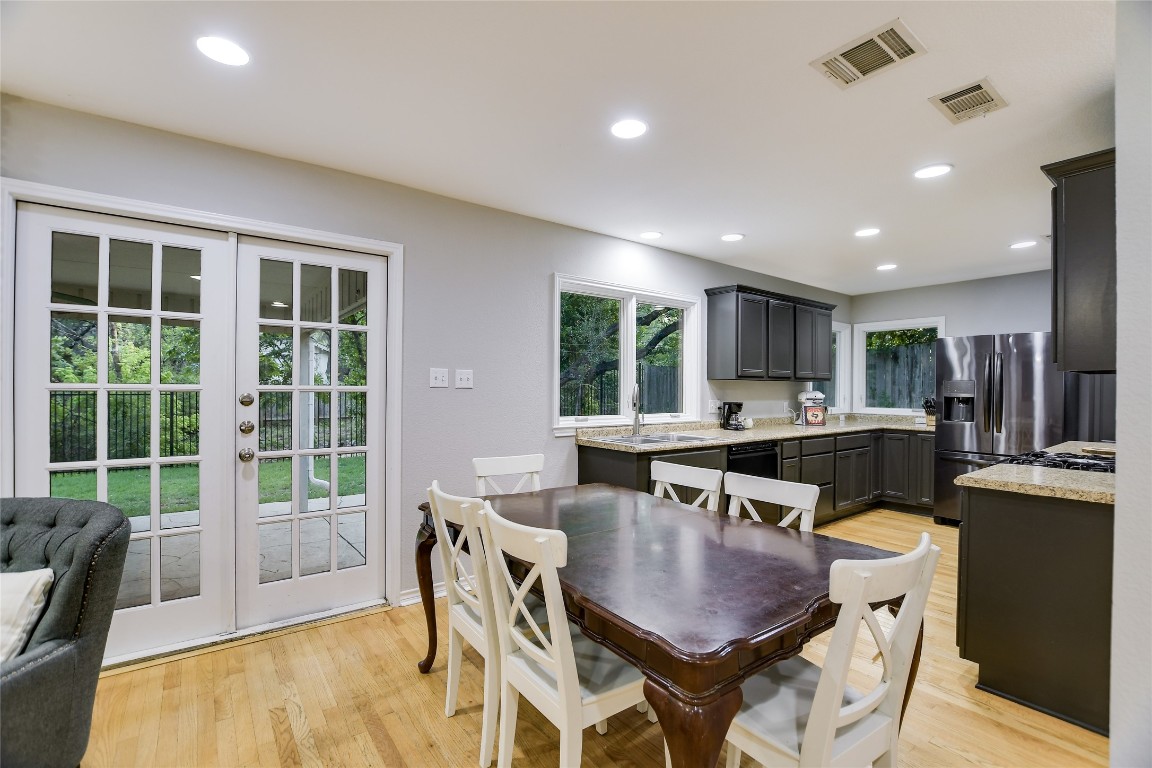 7615 Rockpoint Drive Austin, TX 78731 - Photo 19 of 30 a dining room with furniture and a floor to ceiling window
