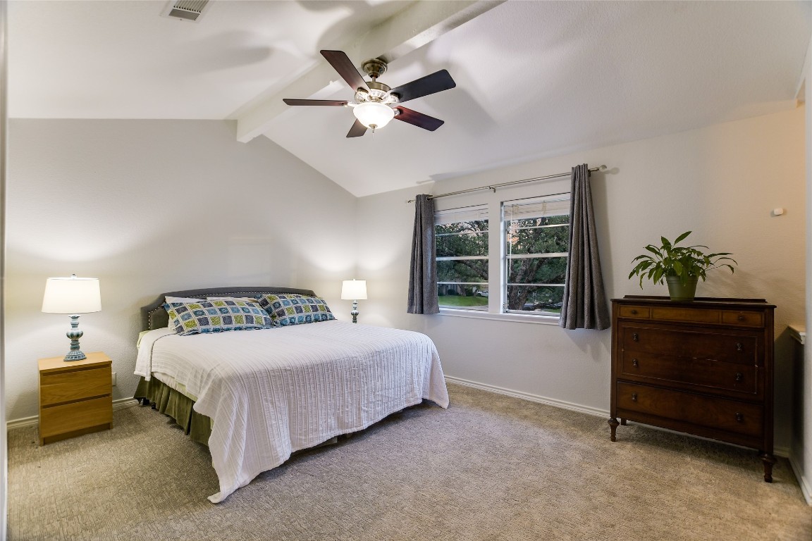 7615 Rockpoint Drive Austin, TX 78731 - Photo 23 of 30 a bedroom with a bed and a potted plant