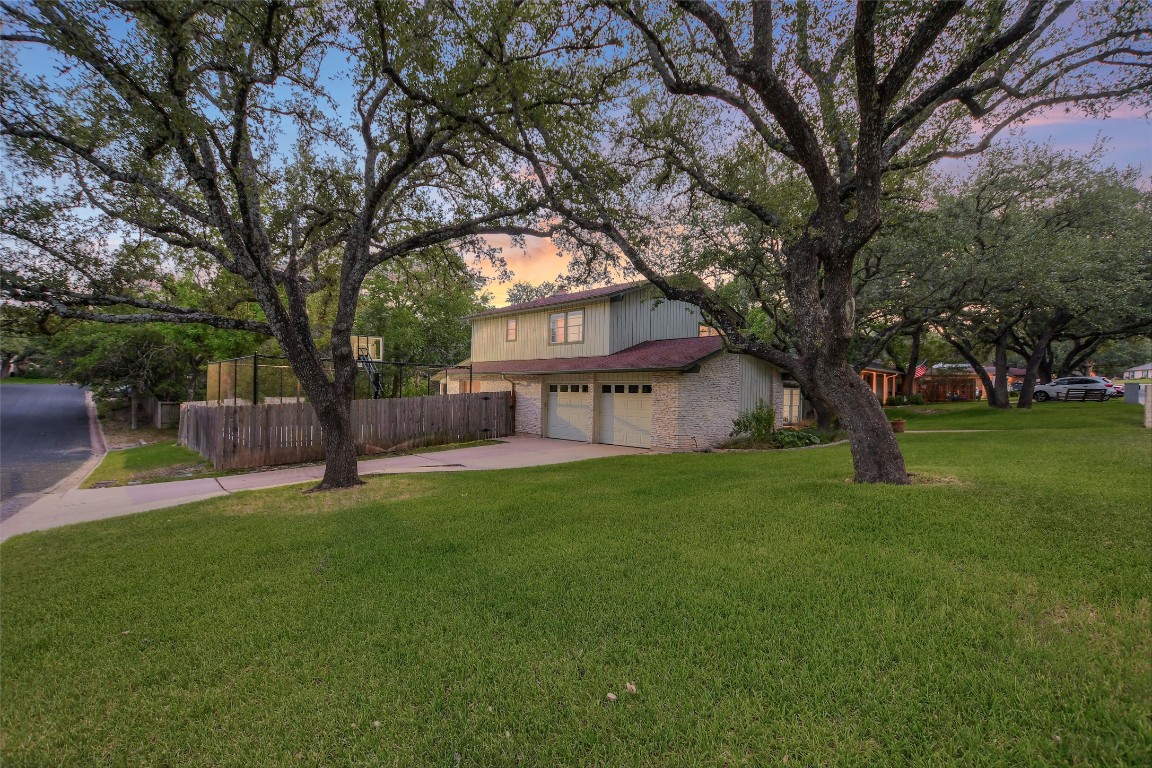 7615 Rockpoint Drive Austin, TX 78731 - Photo 10 of 30 a view of a house with a yard