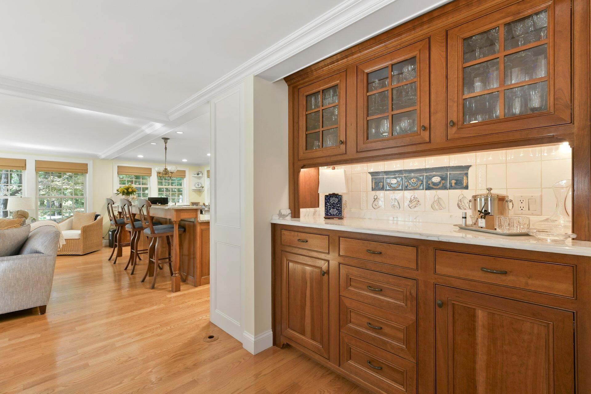 65 Tracey Road Cotuit, MA 02635 - Photo 13 of 36 a very nice looking living room with kitchen furniture and a wooden floor