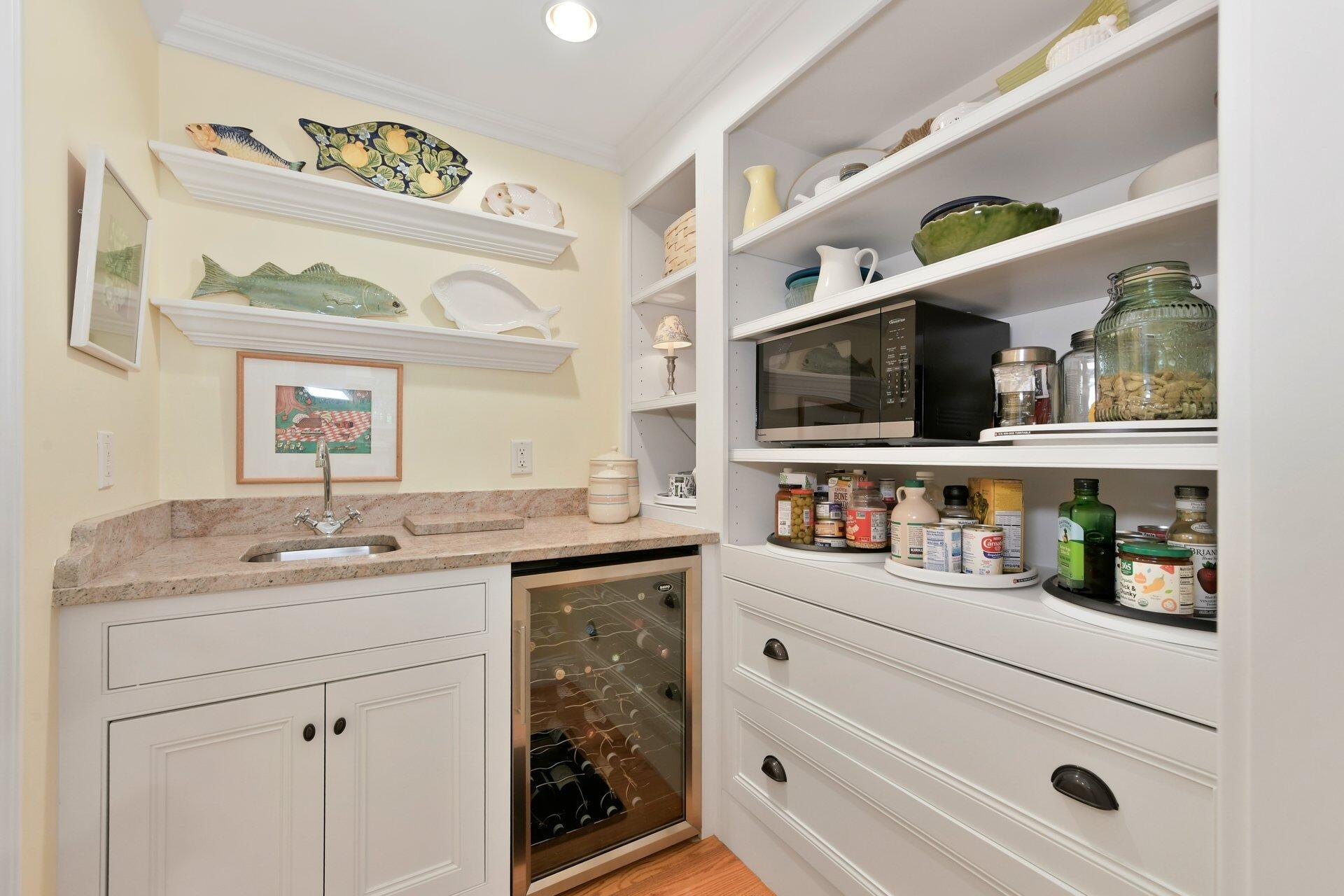 65 Tracey Road Cotuit, MA 02635 - Photo 15 of 36 a kitchen with stainless steel appliances granite countertop a sink and cabinets