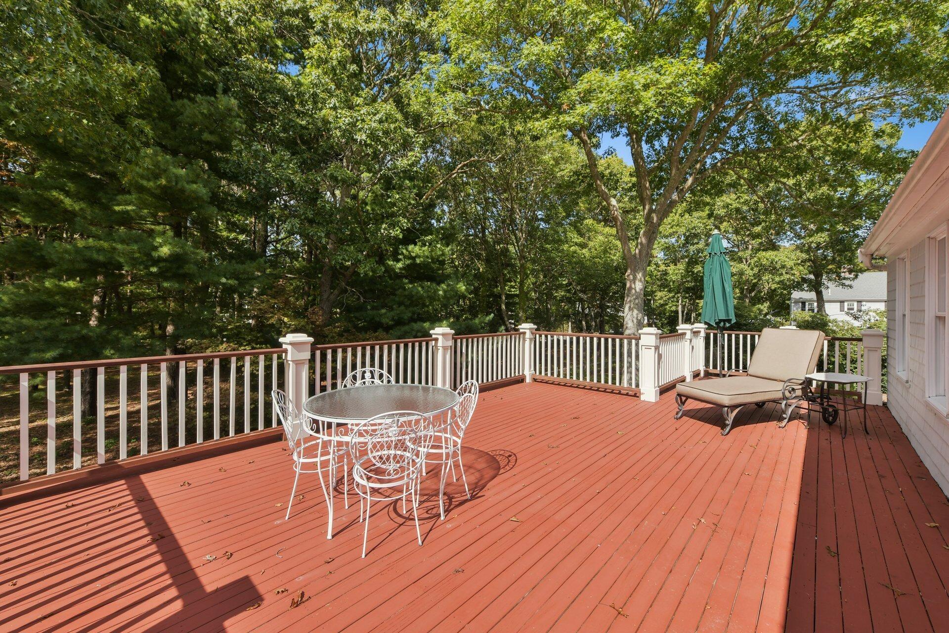 65 Tracey Road Cotuit, MA 02635 - Photo 20 of 36 a view of a chairs and table on the wooden floor