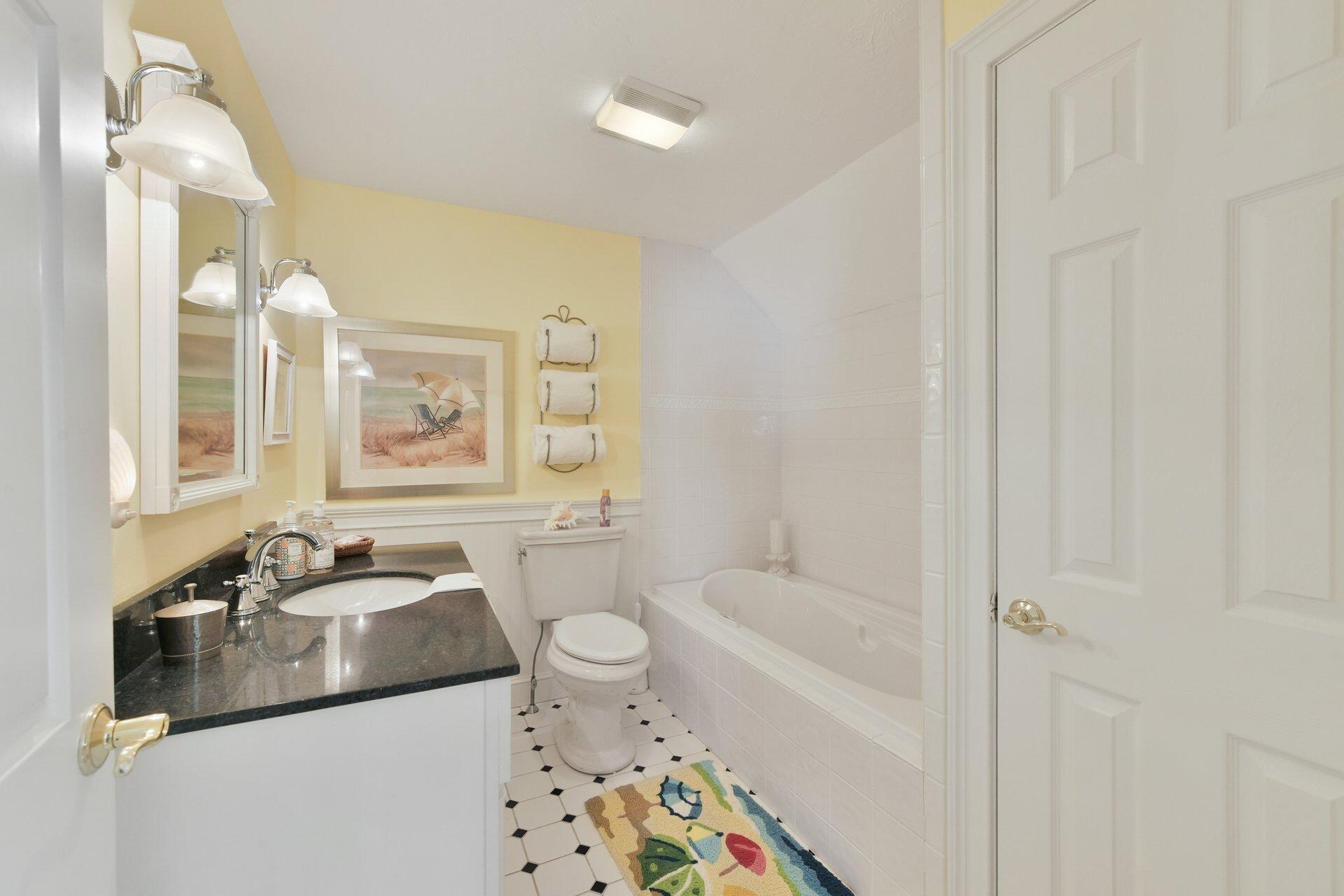 65 Tracey Road Cotuit, MA 02635 - Photo 24 of 36 a bathroom with a sink toilet and shower