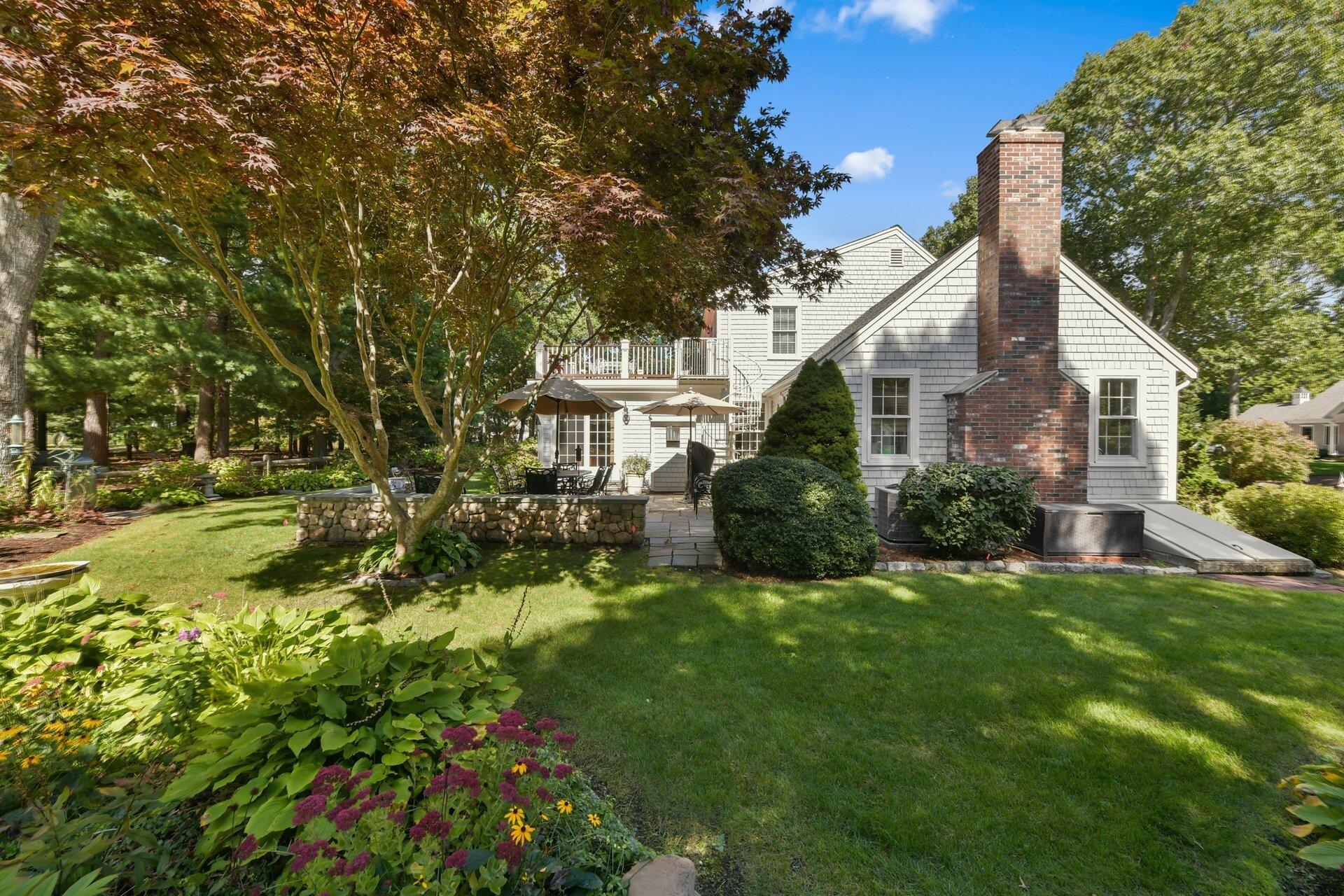 65 Tracey Road Cotuit, MA 02635 - Photo 27 of 36 a house view with a garden space