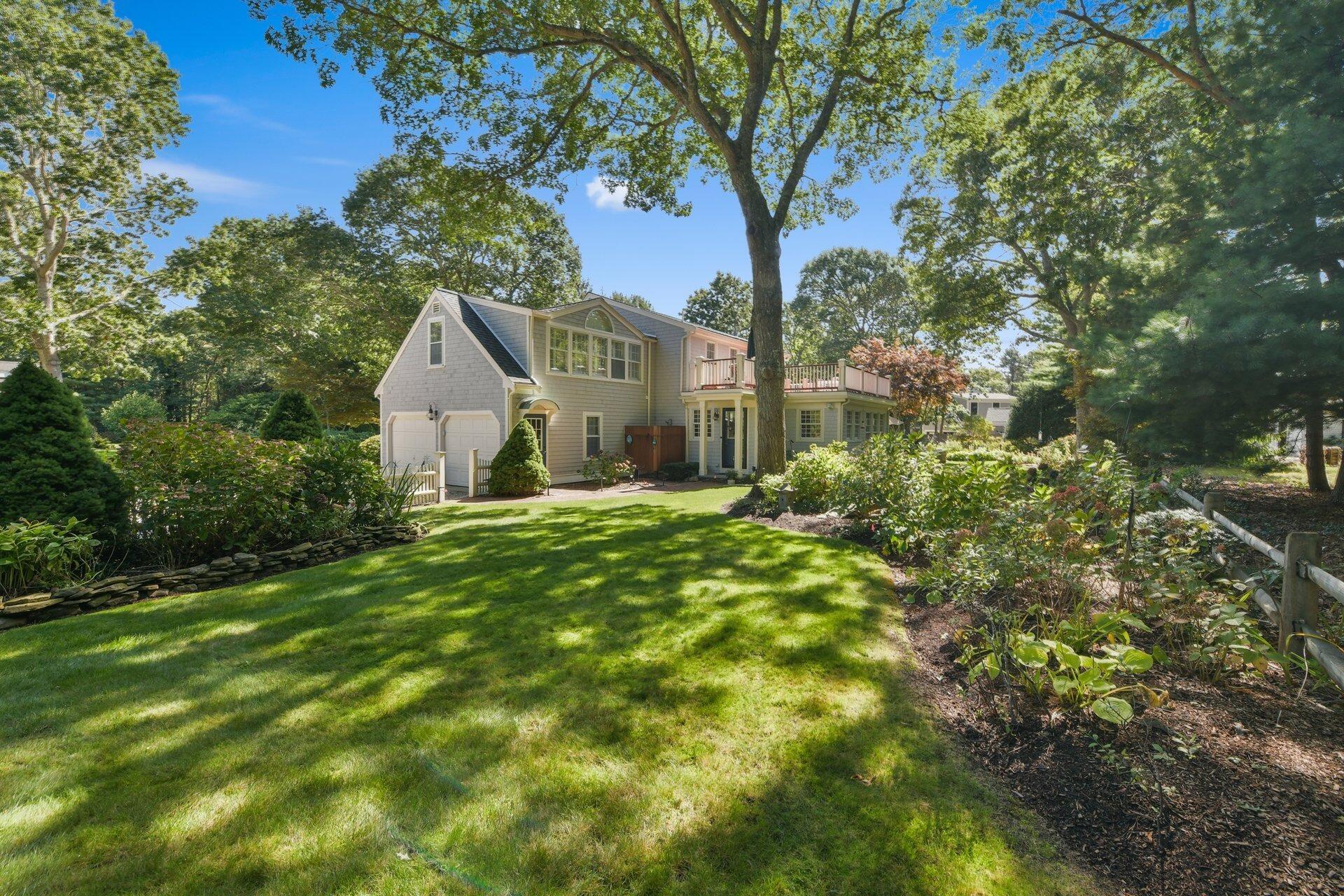 65 Tracey Road Cotuit, MA 02635 - Photo 3 of 36 a view of a house with a yard