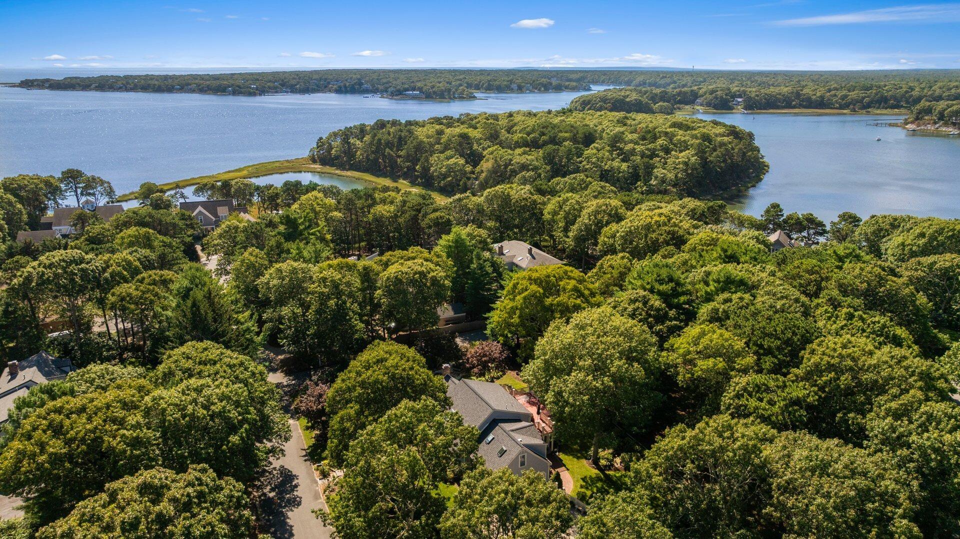 65 Tracey Road Cotuit, MA 02635 - Photo 32 of 36 a view of a lake and mountain
