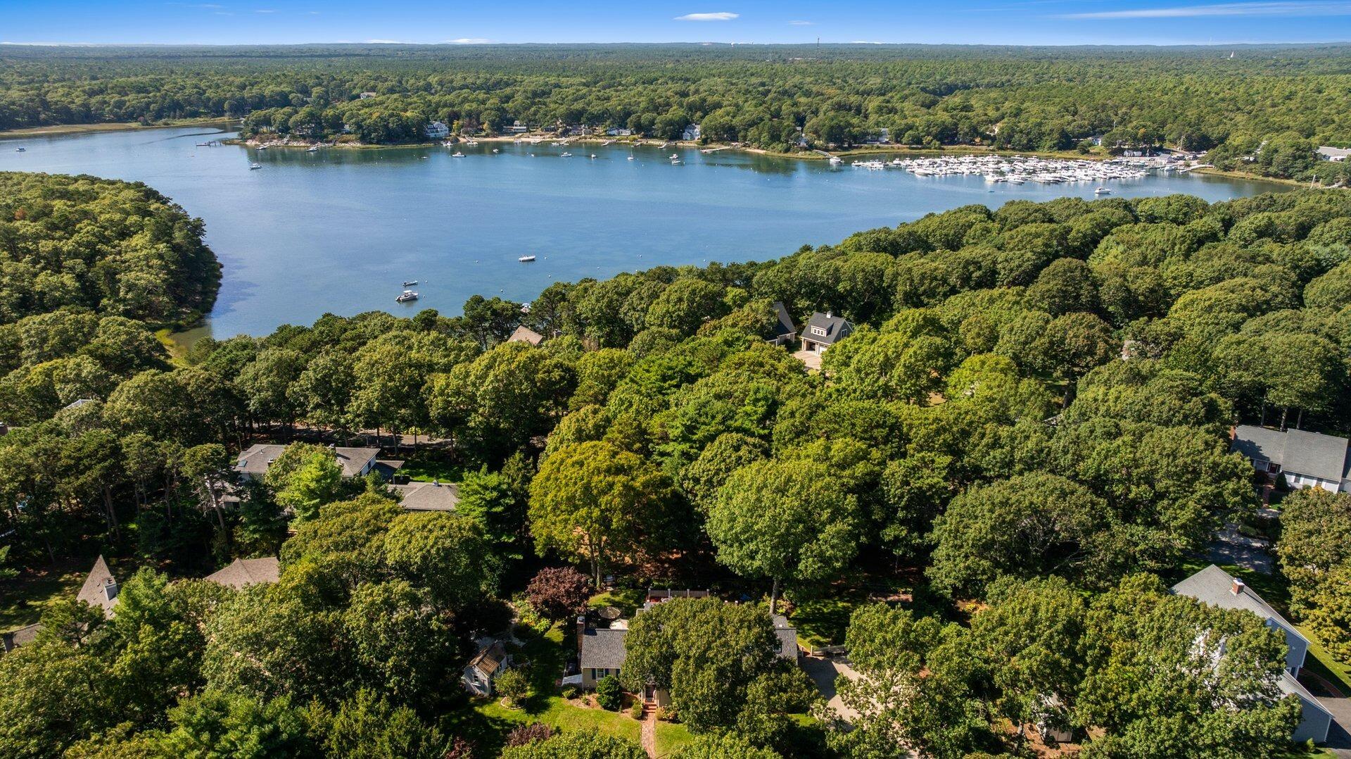 65 Tracey Road Cotuit, MA 02635 - Photo 34 of 36 an aerial view of a houses with a lake view