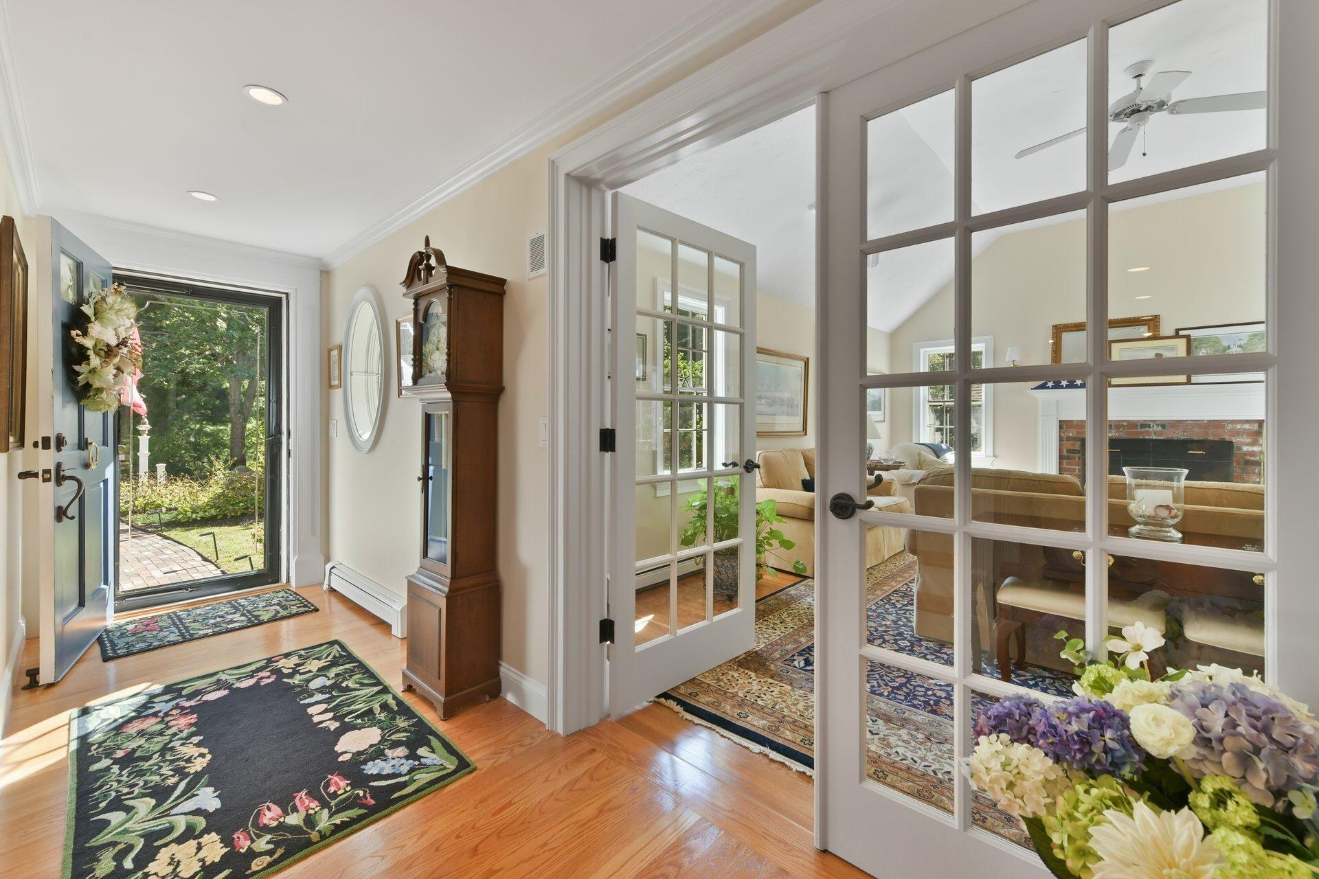 65 Tracey Road Cotuit, MA 02635 - Photo 6 of 36 a view of a entryway with furniture and floor to ceiling window