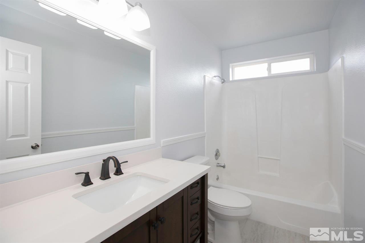 1220 Lattin Road Fallon, NV 89406 - Photo 11 of 25 a bathroom with a sink a toilet and shower
